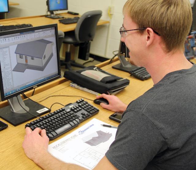 Student working with drafting on a computer