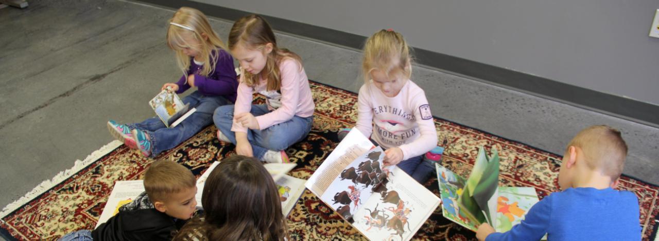 Young children reading books