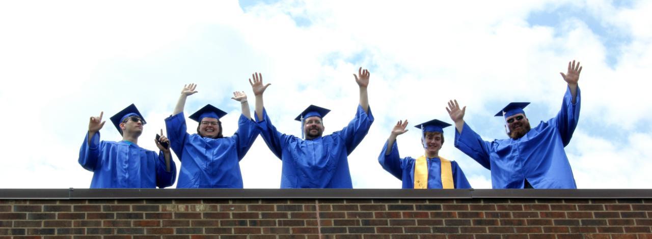 Students on roof looking down.