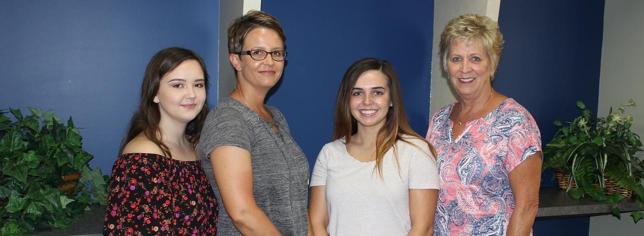 Four people posing for the Betty Thomas Scholarship