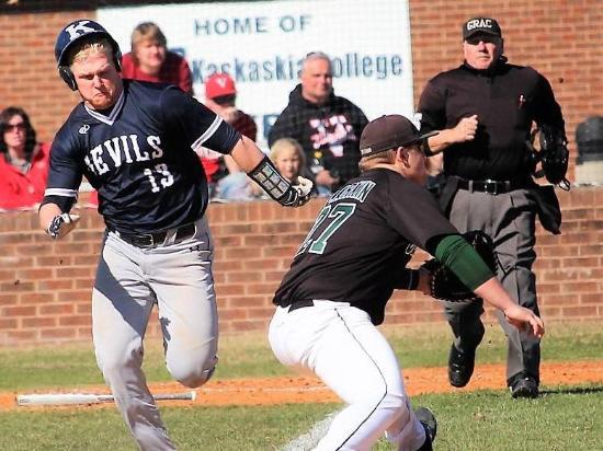 KC baseball player running down to first base.