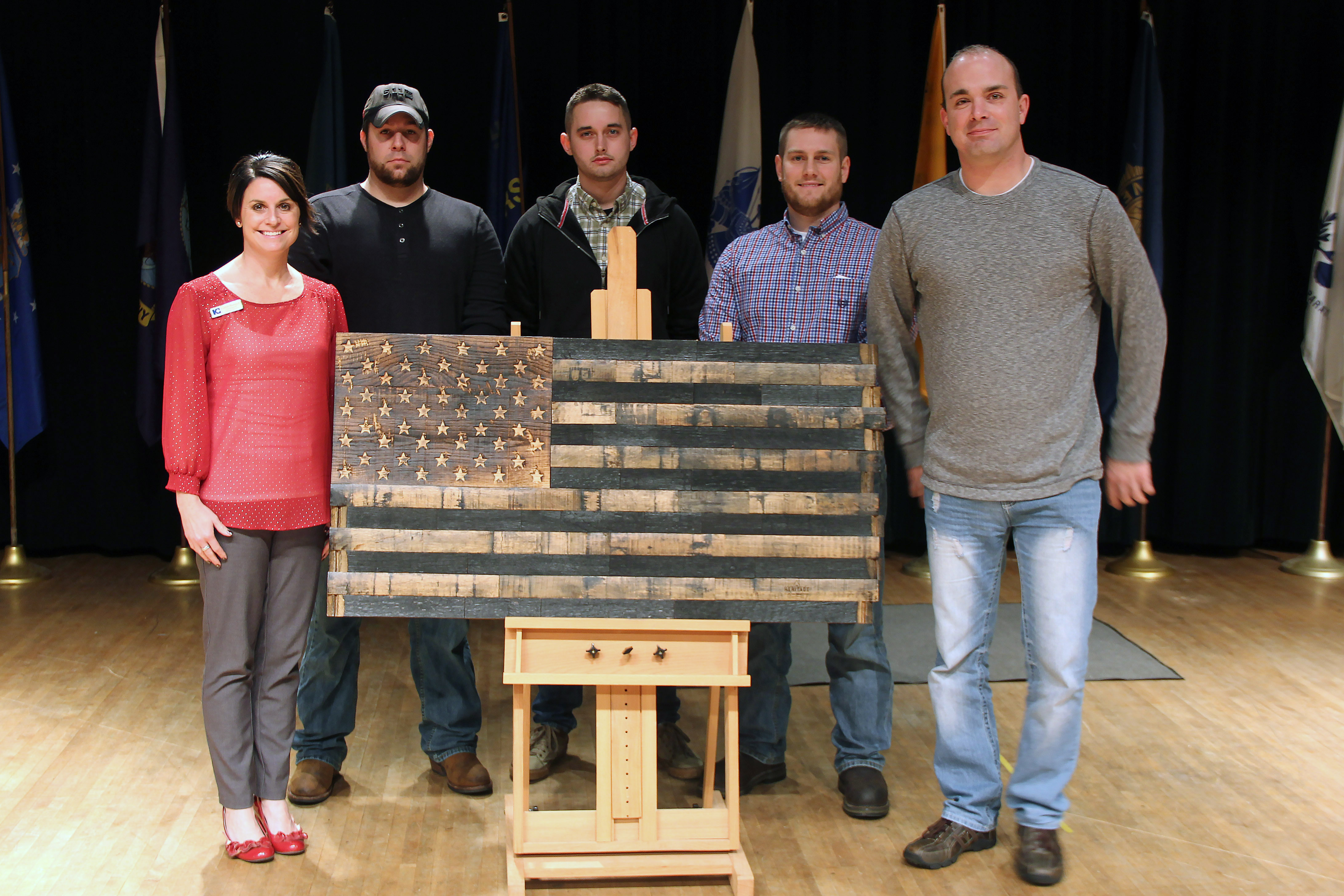 Students with wooden American flag