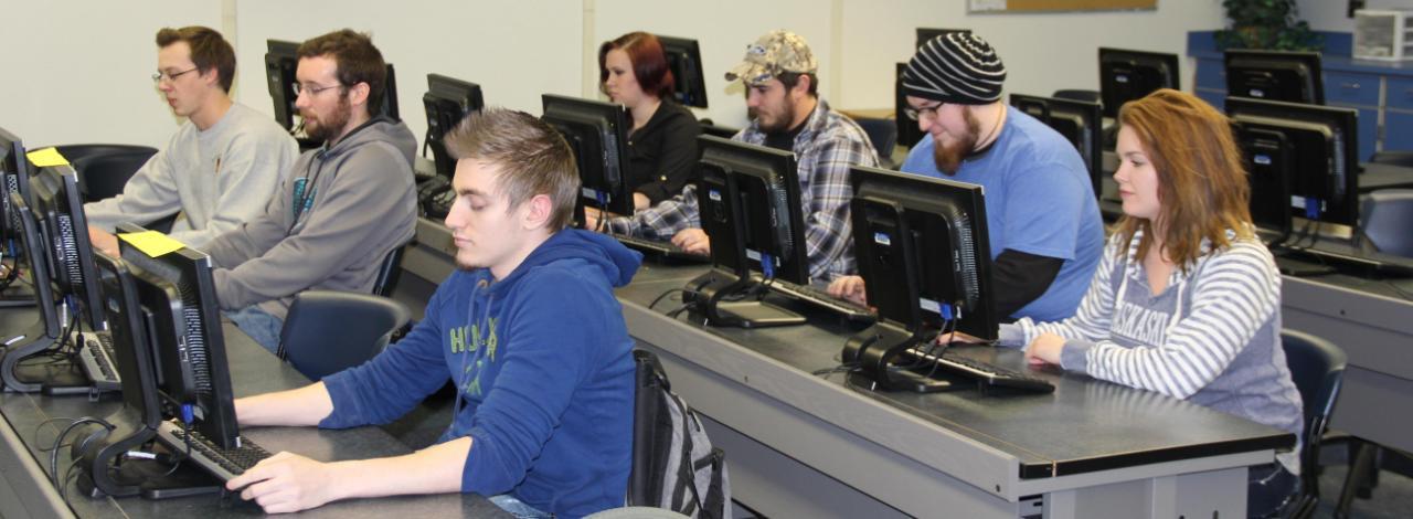Students sitting at computers working
