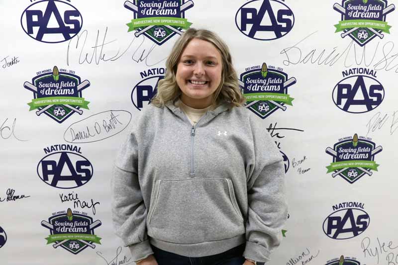 A student in front of a background